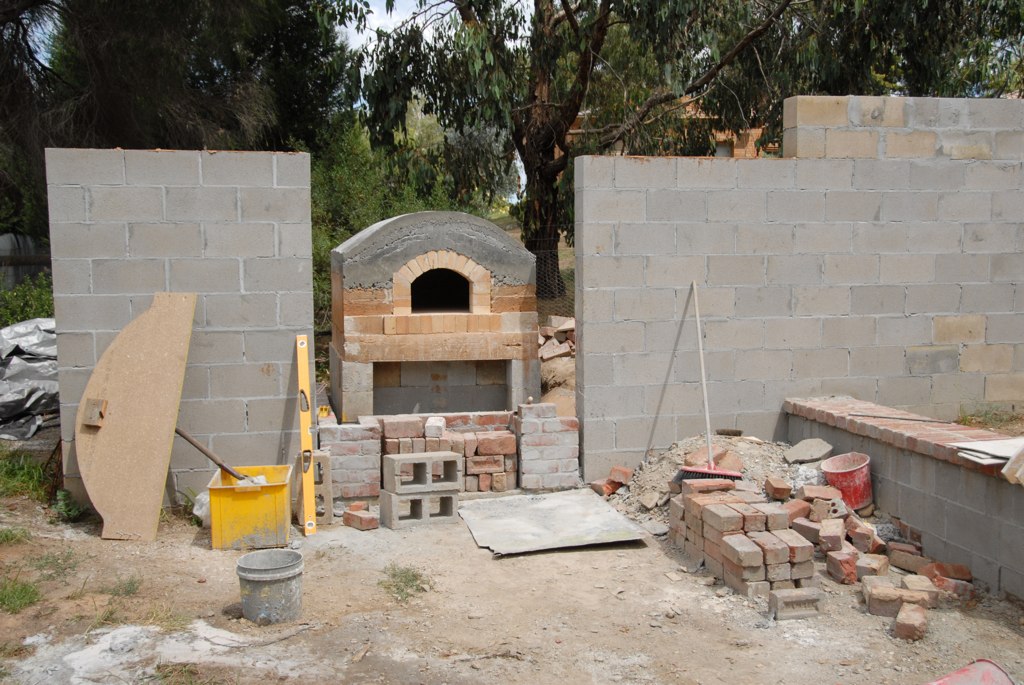 Concrete slab, walls, oven, wall rendering technique.