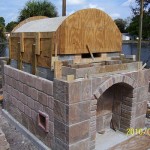 Masterly Tail wood burning oven firebrick dome cladding.