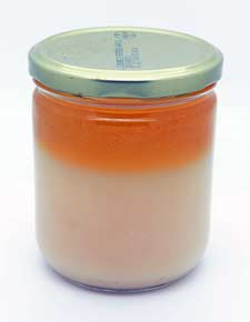Pure fresh goose fat and oil in jar, still hot.