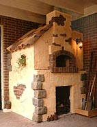 Image of a brick wood burning pizza oven.