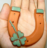 Picture of the horseshoe with four leaf clover, double good luck from traditionaloven.com