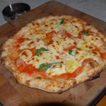 Perfect pizza cooked in brick pizza oven wood fired.