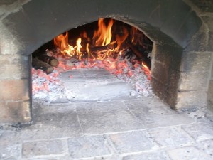 Sweep the embers aside for the roaster.