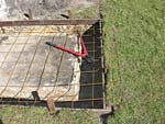 Preparing reinforcing metal into slab and footing.