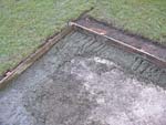 Finishing making concrete footings.