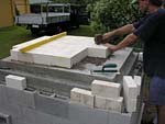 Laying fire brick floor.
