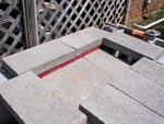 Angle iron pavers work.