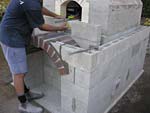 Building entry surface hearth and first decorative arch from house bricks.
