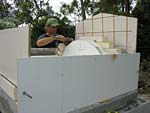 Making masterly tail oven firebrick arches.