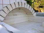 Making masterly tail oven firebrick arches.