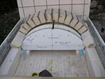Making masterly tail oven firebrick arches.