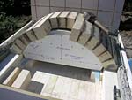 Making masterly tail oven firebrick arches.