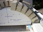 Making masterly tail oven firebrick arches.