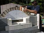 Making masterly tail oven firebrick arches.
