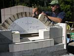 Making masterly tail oven firebrick arches.