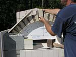 Making masterly tail oven firebrick arches.