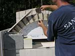 Making masterly tail oven firebrick arches.