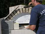 Making masterly tail oven firebrick arches.
