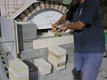 Finishing firebrick work with oven entrance.