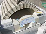 Finishing firebrick work with oven entrance.