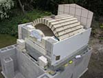 Finishing firebrick work with oven entrance.
