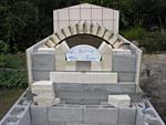 Finishing firebrick work with oven entrance.