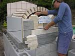 Finishing firebrick work with oven entrance.