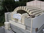 Finishing firebrick work with oven entrance.
