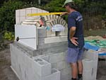 Finishing firebrick work with oven entrance.