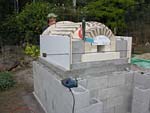 Finishing firebrick work with oven entrance.