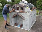 Making flue hood with own arch and front arched decoration.