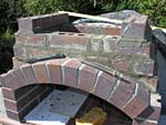 Making flue hood with own arch and front arched decoration.