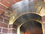 Making flue hood with own arch and front arched decoration.