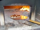 Picture showing using pizza oven paddle.
