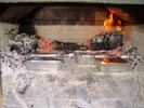 A way of meat meal cooking using fire in wood ovens.