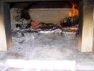 Cooking using fire in brick wood ovens.