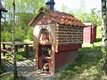 Brick oven with fish smoker project near-by.