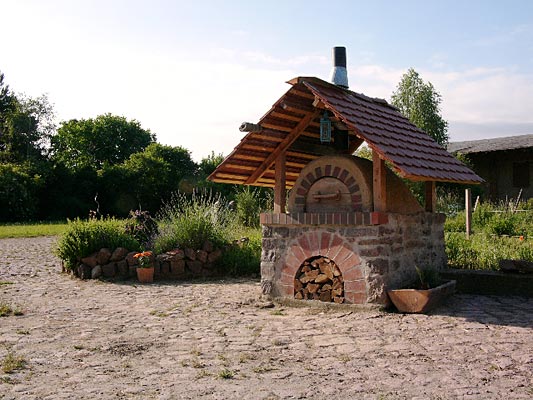 Clay mud adobe outdoor wood fire oven.