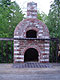 Wood fired brick oven raised high to deck level.