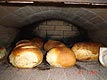 Dutch bakes breads in his oven.