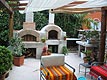 Picture of Italian forno wood pizza brick oven and brick fireplace.