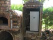 Wood oven with smoker box in one structure.