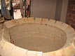 Circular brick oven construction.