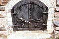 picture of cast iron door on oven for cooking in winter.