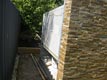 Wood storage under a wood fired brick oven in Perth.