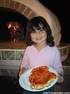 Picture of pizza made in wood oven by 4 year old Erika.