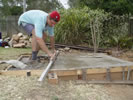 Concrete leveling for a base slab.