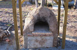 Picture of the garden wood burning oven built of bricks.