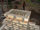Picture shows how I went about wood oven chimney brick decoration.