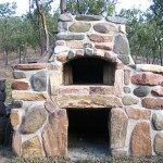 A river-rock on the oven's outside decoration.